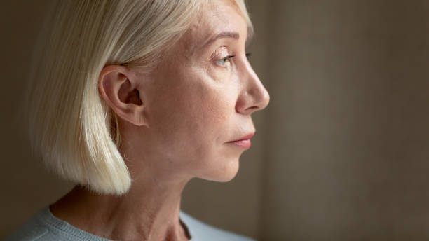 istock Lost in thoughts upset mature woman feeling lonely. 1182440309