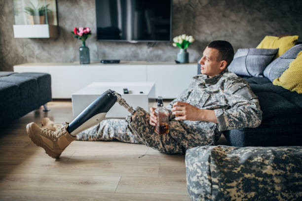 istock US soldier drinking alcohol at home alone 1182440713
