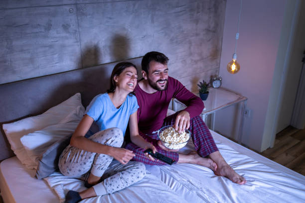 istock Couple watching a movie in bed 1182441939