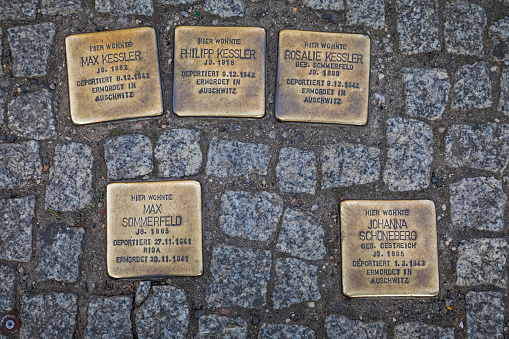Central Berlin, Berlin, Germany, September 23, 2019: Plaques on the streets of Berlin which gives information about the Jews who lived here before and were deported or killed. They mark the adresses of the victims.