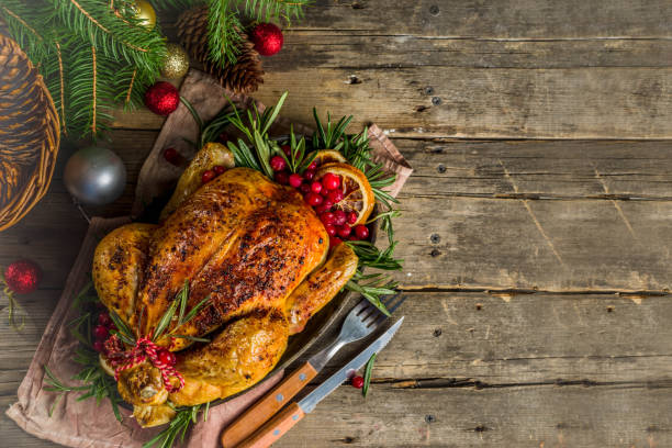 istock Roasted whole chicken with Christmas decoration 1182446065