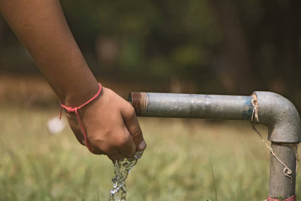 istock Water flowing through a lead pipe in a open park 1182446141