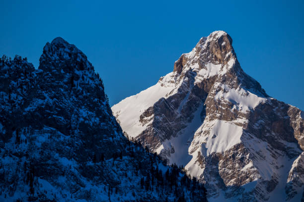 istock Mountain peaks in the shade and sunlit 1182447552