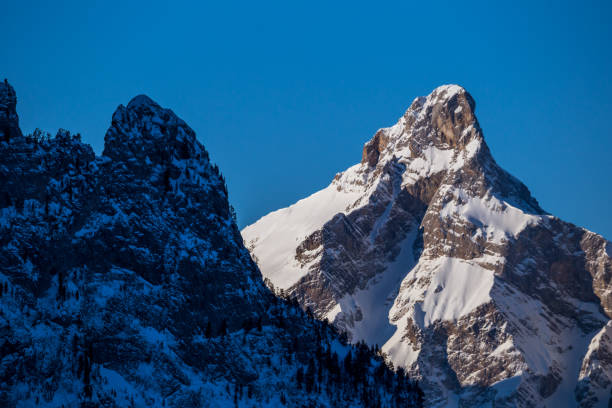 istock Mountain peaks in the shade and sunlit 1182447560