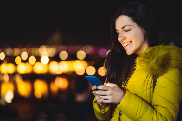 istock Woman texting at night 1182447632