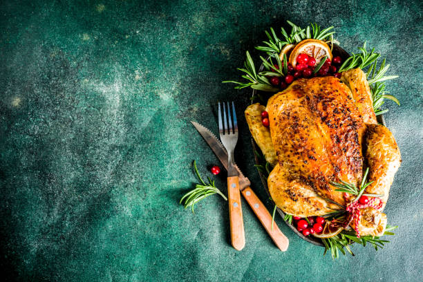 istock Roasted whole chicken with Christmas decoration 1182447642