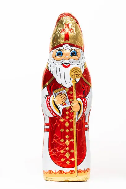 Photo of Chocolate Sinterklaas figure, shoe gift, candy, sweets, typical Dutch, for kids, white isolated background