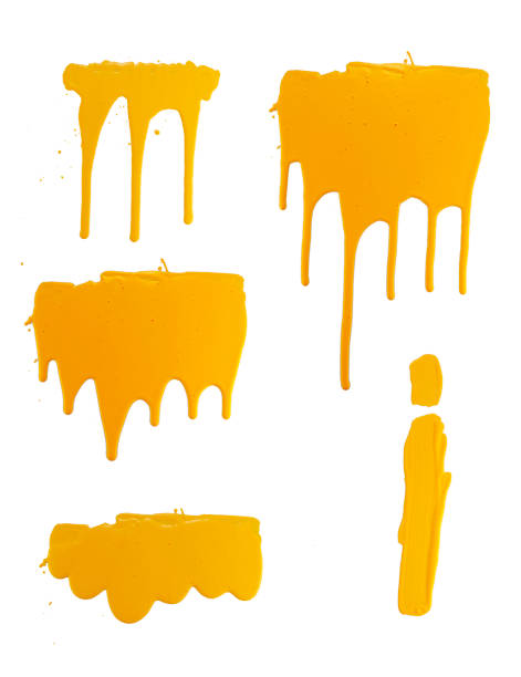istock options flowing yellow paint on a white background. isolate. close up of paint leaking down 1182448657