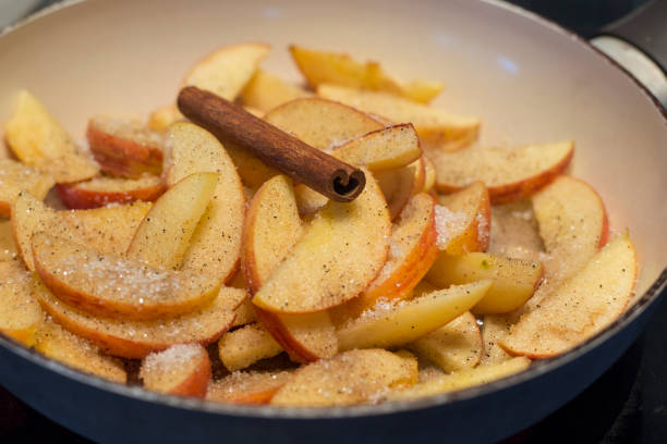 istock Caramelized apples close up in pan top view 1182448724