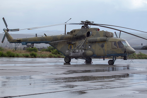 Combat vehicle military helicopter at the airport