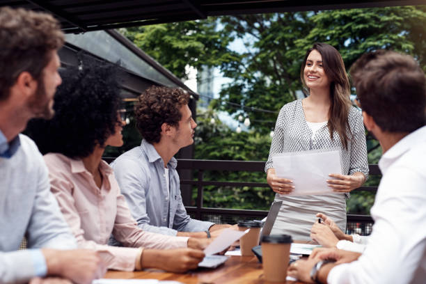 istock Presenting her opinion on business progress 1182450717