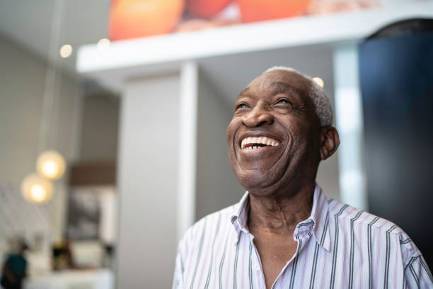 istock Happy senior man at home, looking away 1182452133