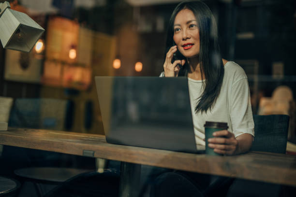 istock Young woman working on laptop in cafe 1182452206