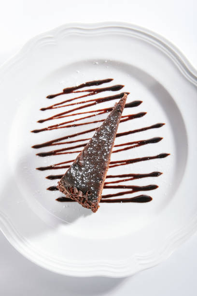 istock Chocolate Cake, Triangular Slice of Brown Biscuit Tart or Sachertorte 1182454437
