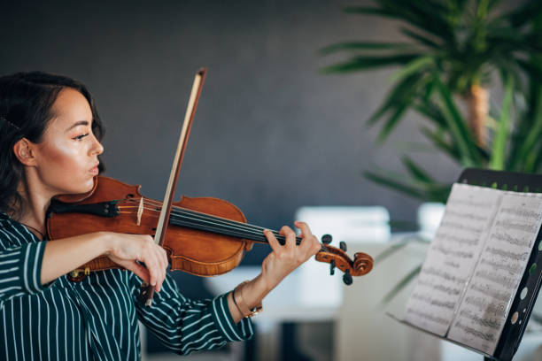 istock Beautiful Violinist Woman 1182454587