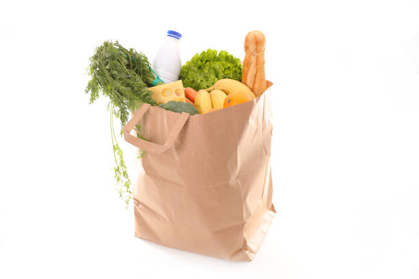 istock paper bag with grocery on white background 1182455464
