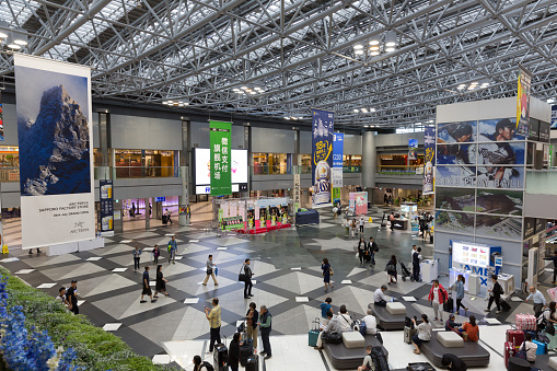 Chitose, Japan - August 23, 2019 : People at the New Chitose Airport in Hokkaido, Japan. New Chitose Airport opened in 1991. It is the largest airport in Hokkaido.