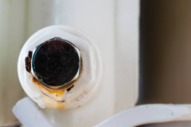 istock Bottom plug of a central heating radiator. 1182458592