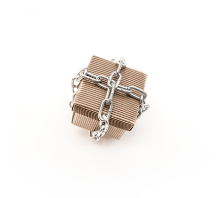 Cardboard cube in chains.