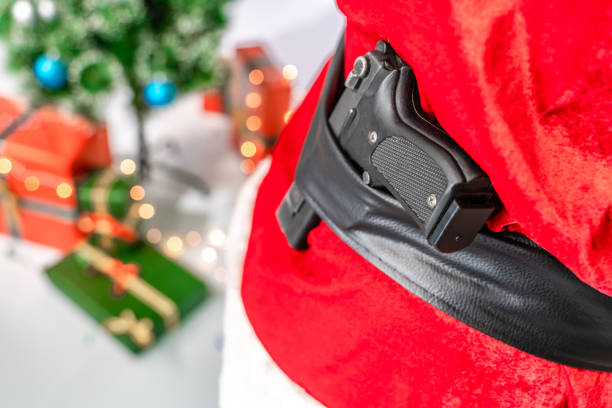 istock Pistol in Santa Claus belt 1182459209