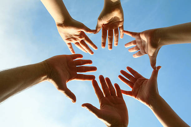 istock Six hands reaching towards each other 118246209
