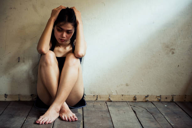 istock Stressed woman headache in dirty room 1182462885