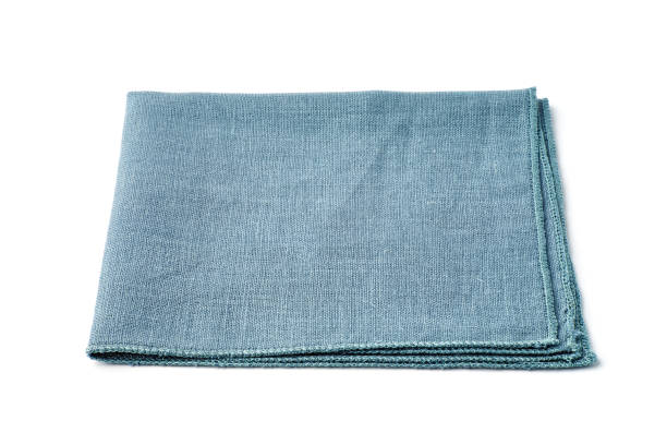 istock Single turquoise textile napkin on white background 1182463229