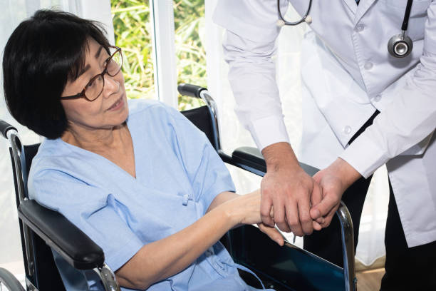 istock Disabled patient on wheelchair visiting doctor for regular check 1182463334