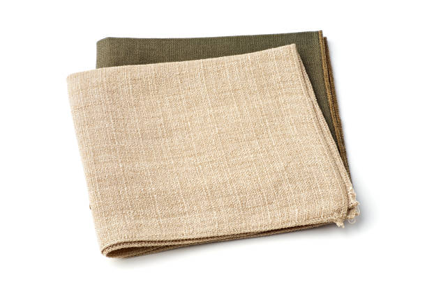 istock Green and beige textile napkins on white 1182463444