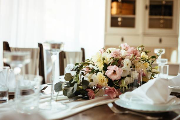 istock Floral centerpiece on wedding dining table. 1182463557