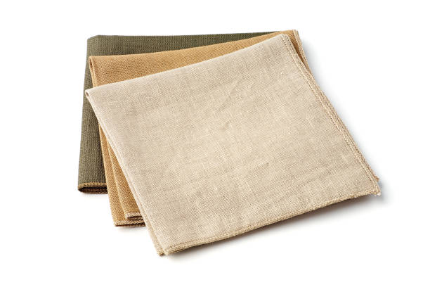 istock Three colorful textile napkins on white background 1182463564