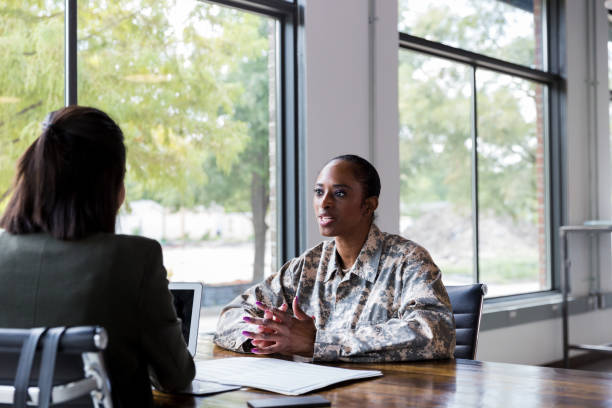 istock Female soldier meets with financial advisor 1182464312