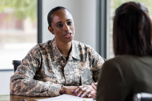 istock Female soldier talks with counselor 1182464330