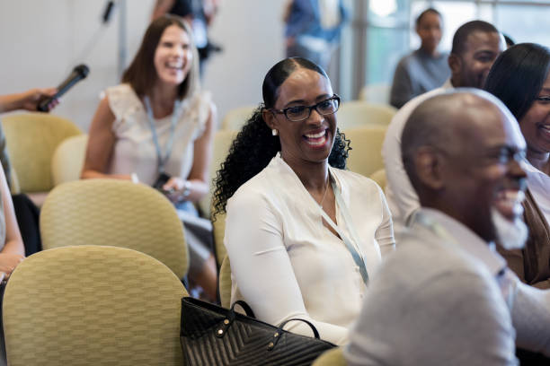 istock Happy businesspeople laugh during conference 1182464449