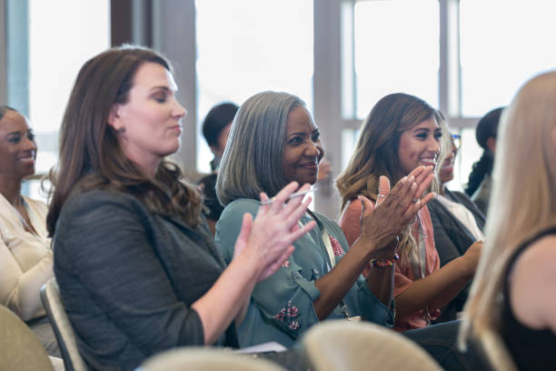 istock Businesspeople applaud presentation 1182464457