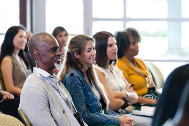 istock People listen during business conference 1182464483