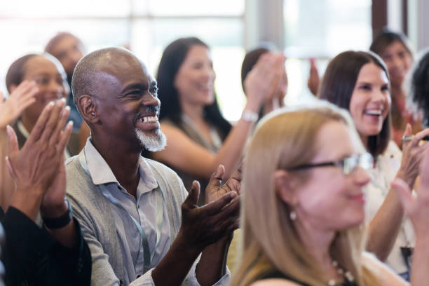 istock Audience applauds during business conference 1182464488