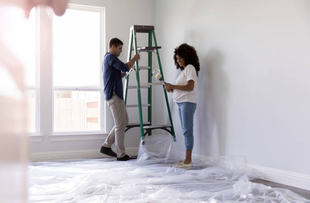 istock Couple working together on DIY project 1182464631