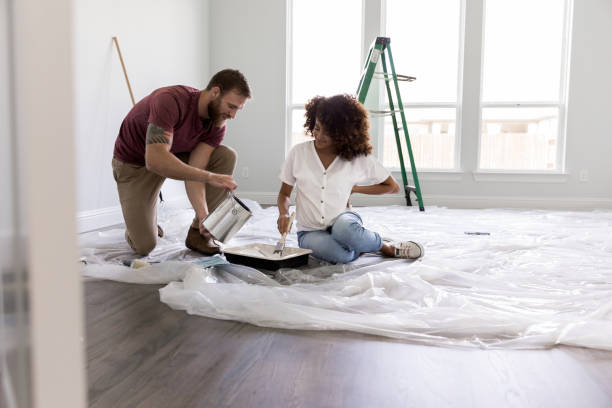 Couple paint room in house