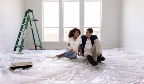 istock Happy couple relax after painting 1182464648
