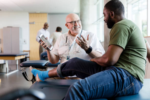 istock Mature therapist smiles while describing treatment options with veteran 1182464768