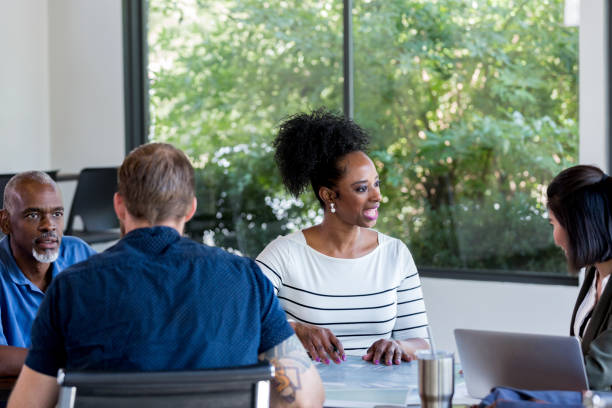 istock Meeting breaks up into small groups for further discussion 1182464810