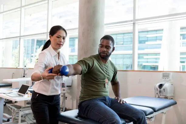 Photo of Injured soldier in physical therapy