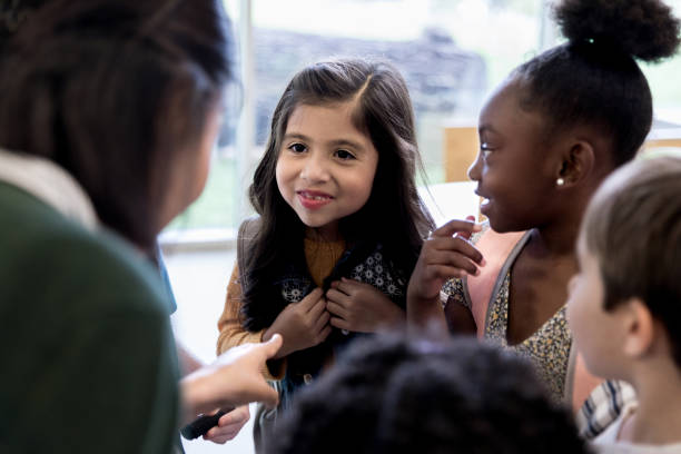 istock Adorable children in kindergarten class 1182465182