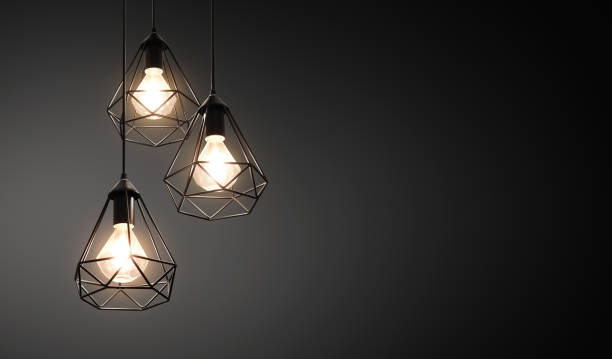 istock Decorative ceiling lights / hanging lights on dark background with copy space 1182466501