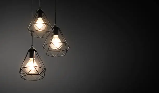 Photo of Decorative ceiling lights / hanging lights on dark background with copy space