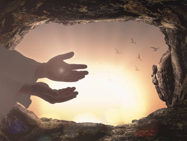 Easter Sunday concept Silhouette scars In hands of Jesus Christ at tomb stone sunrise background easter sunday photos stock pictures, royalty-free photos & images