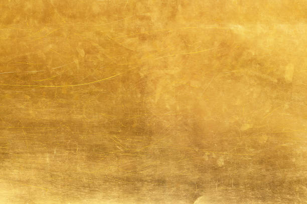 istock Gold abstract background or texture distress  scratch and gradients shadow 1182467684