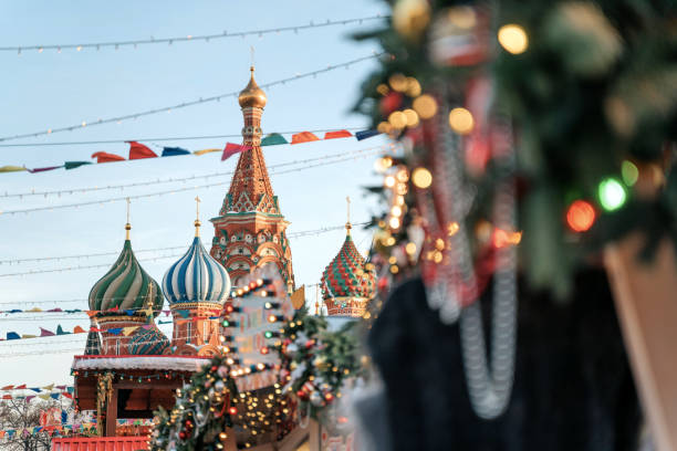 istock Christmas decorations. Christmas tree branches near to St. Basil's Cathedral on Red square in Moscow 1182468956