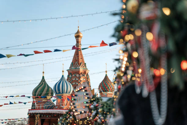 istock Christmas decorations. Christmas tree branches near to St. Basil's Cathedral on Red square in Moscow 1182468969